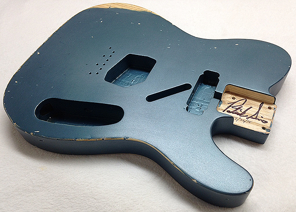 aquamarine metallic fender guitar