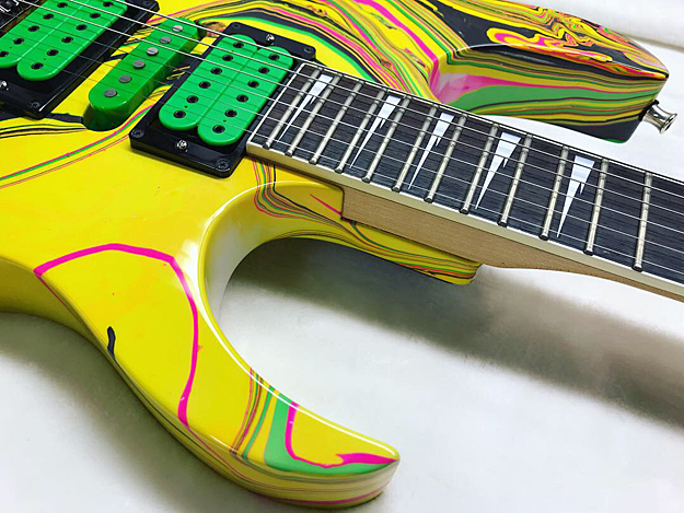 yelow swirl painted guitar